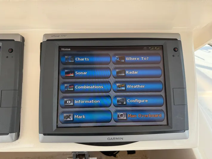 Fishin' Feinz Yacht Photos Pics Garmin GPS display on 2008 Grady-White 330 Express boat showing navigation options.