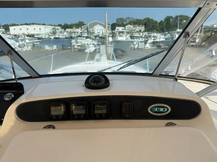 Fishin' Feinz Yacht Photos Pics 2008 Grady-White 330 Express boat dashboard with marina view in background.