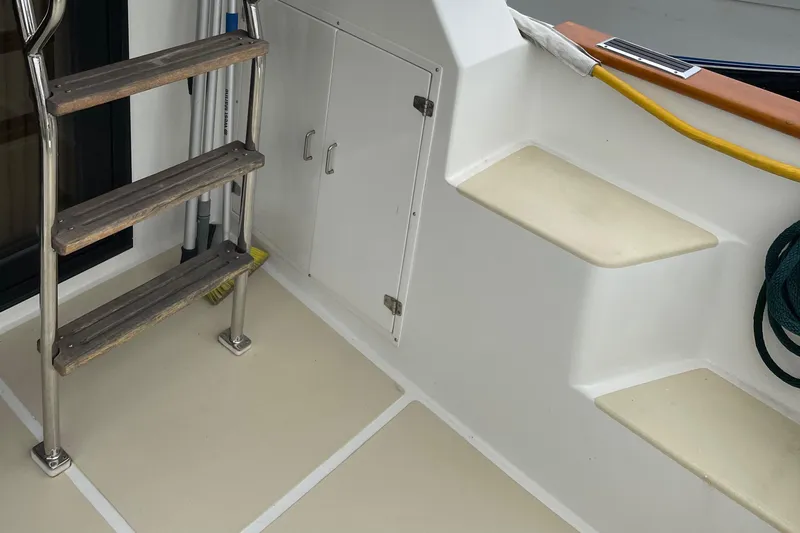 Eagles Soar Yacht Photos Pics Staircase and storage on a 2000 Hampton 490 boat deck.