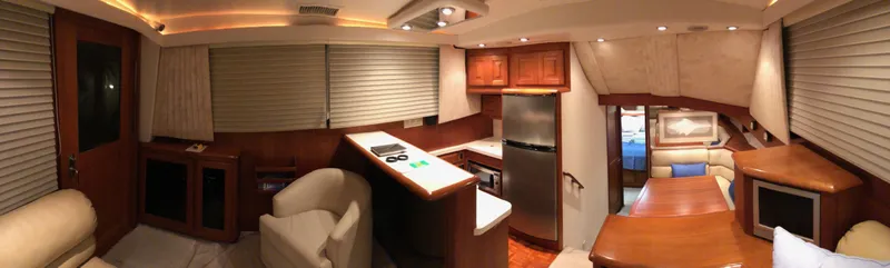 Pigal Yacht Photos Pics Interior of a 1990 Viking 38 Convertible yacht with modern kitchen and seating area.