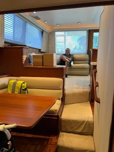 Pigal Yacht Photos Pics Interior of a 1990 Viking 38 Convertible yacht with seating and dining area.