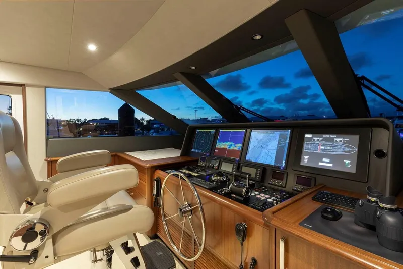  Yacht Photos Pics Helm of 2014 Pacific Mariner 85 Motor Yacht with advanced navigation systems at sunset.