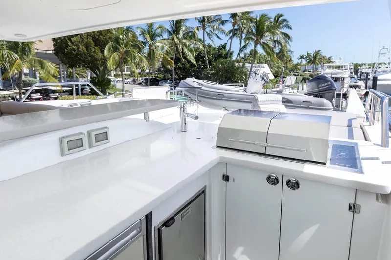  Yacht Photos Pics Luxurious 2014 Pacific Mariner 85 Motor Yacht with outdoor kitchen and scenic marina view.