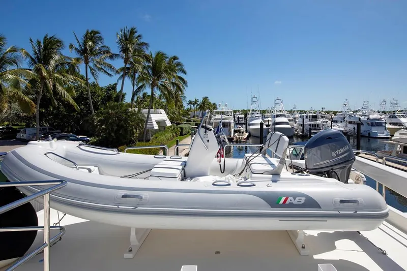  Yacht Photos Pics 2014 Pacific Mariner 85 Motor Yacht with tender, docked in a sunny marina.