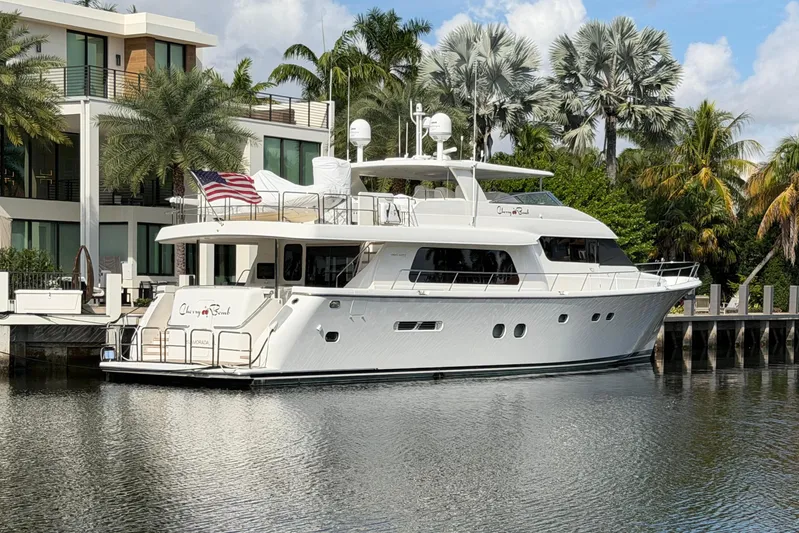  Yacht Photos Pics 2014 Pacific Mariner 85 Motor Yacht docked by luxury waterfront home.