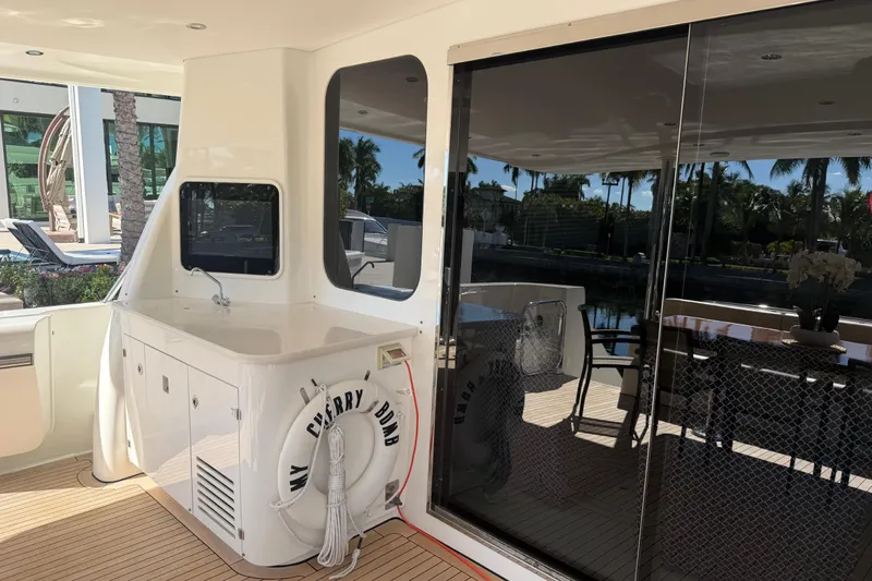  Yacht Photos Pics 2014 Pacific Mariner 85 Motor Yacht deck with seating and life preserver.
