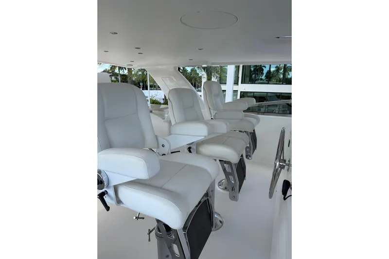 Yacht Photos Pics Luxurious white seating on 2014 Pacific Mariner 85 Motor Yacht's helm station.