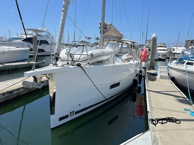 Gem Yacht Photos Pics 2022 Dufour 390 sailboat docked at a marina.