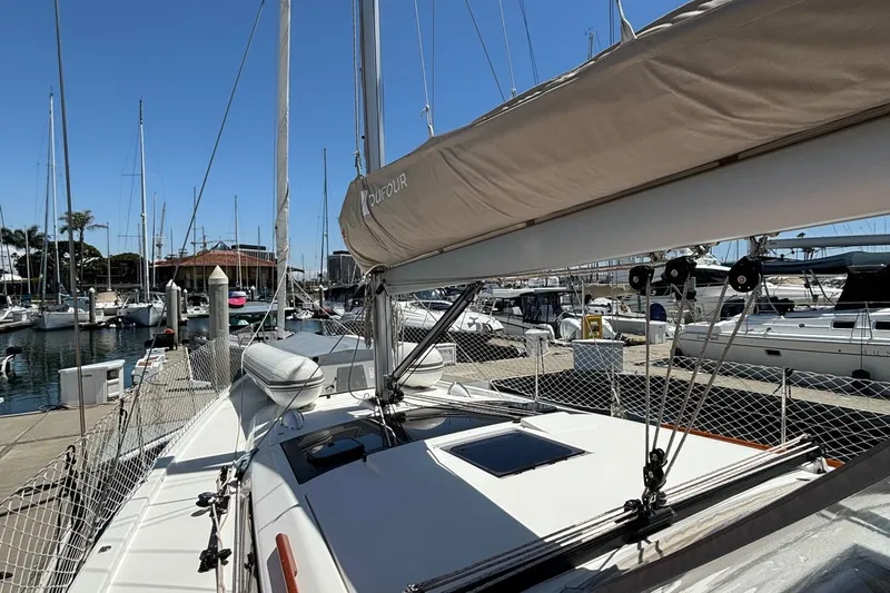 Gem Yacht Photos Pics 2022 Dufour 390 sailboat docked at marina on a sunny day.
