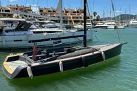 2023 Tofinou 9.7 sailboat docked in a marina, surrounded by other boats.