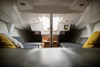 Interior of 2023 Tofinou 9.7 sailboat, featuring modern seating and sleek design.