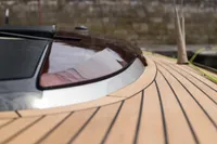 Tofinou 9.7 yacht deck, 2023 model, featuring sleek wood finish and modern design elements.