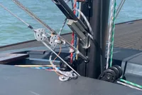 2023 Tofinou 9.7 sailboat deck with rigging and ropes, sailing on calm waters.
