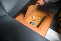 Hidden storage compartment in 2023 Tofinou 9.7 yacht with keys and remote.
