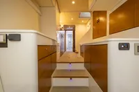 Luxurious interior of a 2018 Tag 60 yacht with wooden accents and modern lighting.