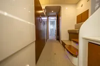 Luxurious interior of 2018 Tag 60 yacht with modern design and wooden accents.