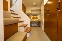 Luxurious interior of 2018 Tag 60 yacht with wooden finishes and modern design.