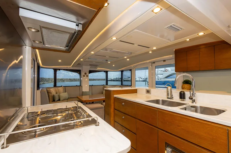  Yacht Photos Pics Luxurious interior of 2018 Tag 60 yacht with modern kitchen and scenic ocean view.