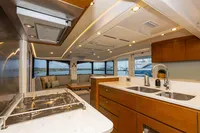 Luxurious interior of 2018 Tag 60 yacht with modern kitchen and scenic ocean view.