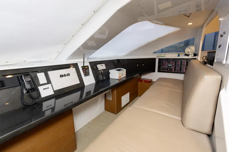  Yacht Photos Pics Interior of 2018 Tag 60 yacht with navigation equipment and seating area.