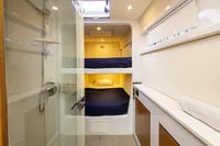 Compact yacht cabin with bunk beds and shower, Tag 60 model, 2018.