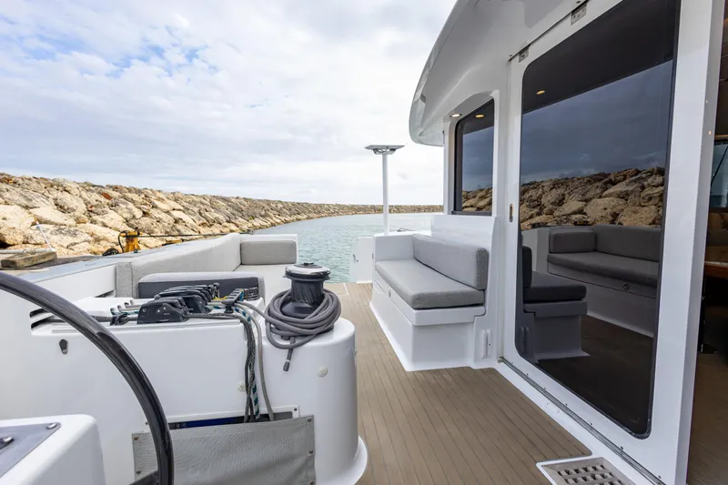  Yacht Photos Pics Deck view of 2018 Tag 60 boat with seating and ocean backdrop.