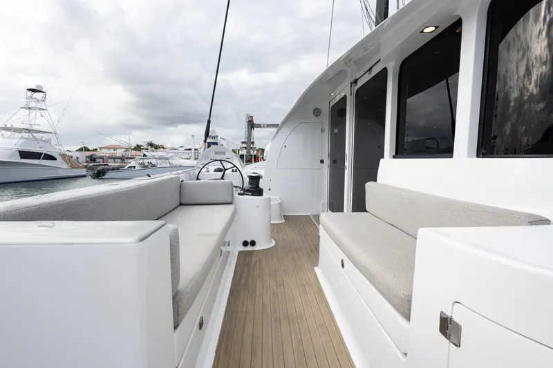  Yacht Photos Pics Spacious deck of 2018 Tag 60 yacht with comfortable seating and modern design.
