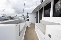 Spacious deck of 2018 Tag 60 yacht with comfortable seating and modern design.