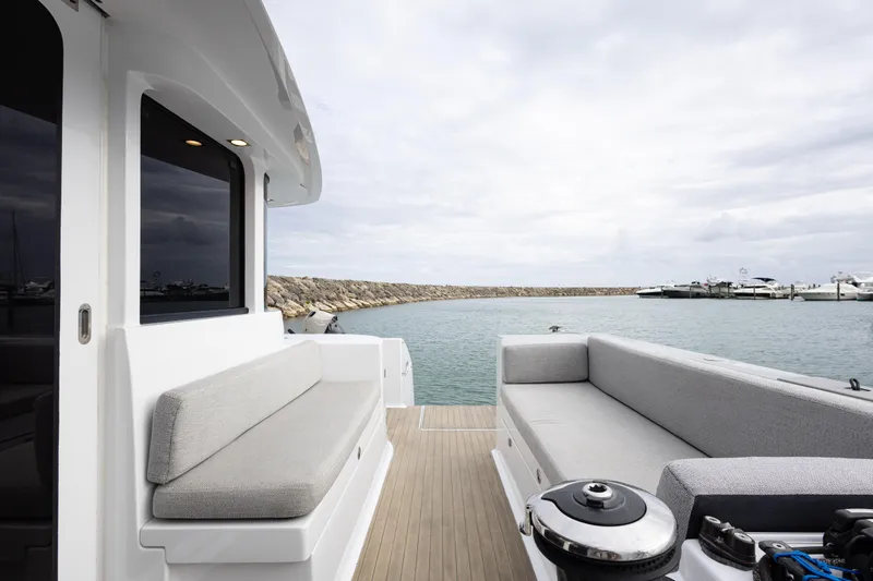  Yacht Photos Pics Spacious deck of 2018 Tag 60 yacht with comfortable seating and ocean view.