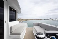Spacious deck of 2018 Tag 60 yacht with comfortable seating and ocean view.