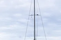 2018 Tag 60 catamaran docked in a marina, overcast sky.