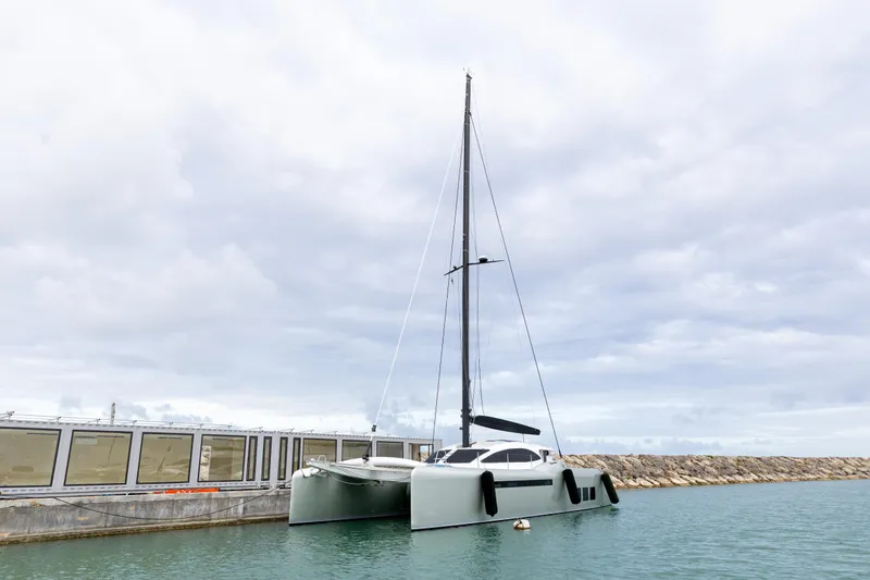  Yacht Photos Pics 2018 Tag 60 catamaran docked at a marina under cloudy skies.