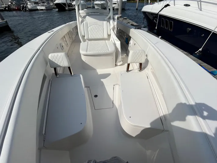  Yacht Photos Pics 2020 Jupiter 34 Center Console boat interior with white seating and storage compartments.