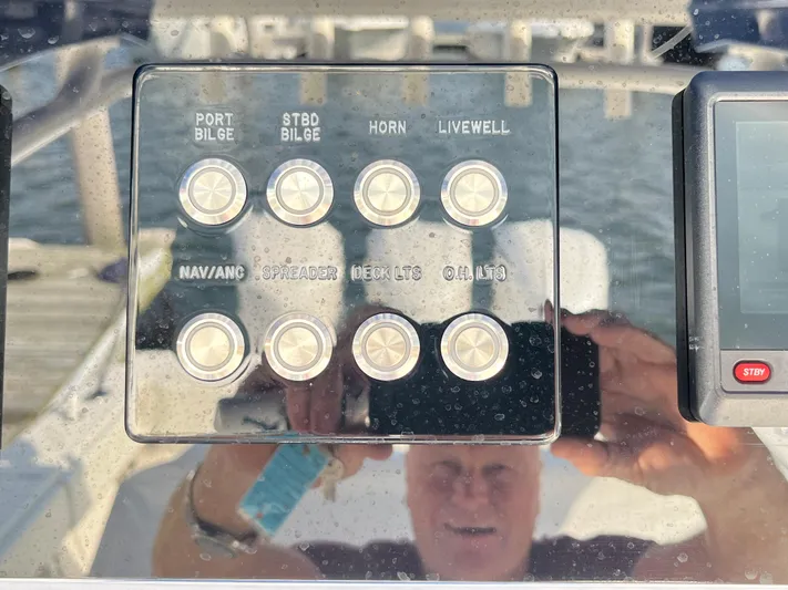  Yacht Photos Pics Control panel of a 2020 Jupiter 34 Center Console boat with various switches.