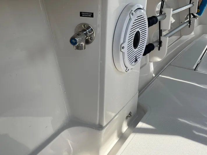  Yacht Photos Pics 2020 Jupiter 34 Center Console boat interior with speaker and fishing rod holders.