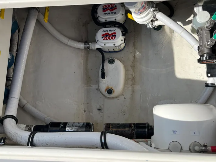 Yacht Photos Pics 2020 Jupiter 34 Center Console bilge area with pumps and hoses.