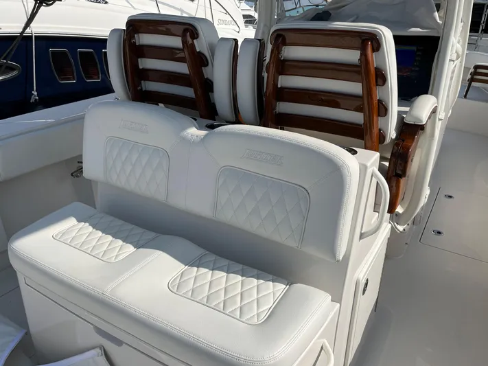  Yacht Photos Pics Luxurious seating on 2020 Jupiter 34 Center Console boat with elegant white upholstery.