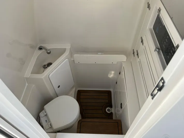  Yacht Photos Pics 2020 Jupiter 34 Center Console boat bathroom with sink and toilet.
