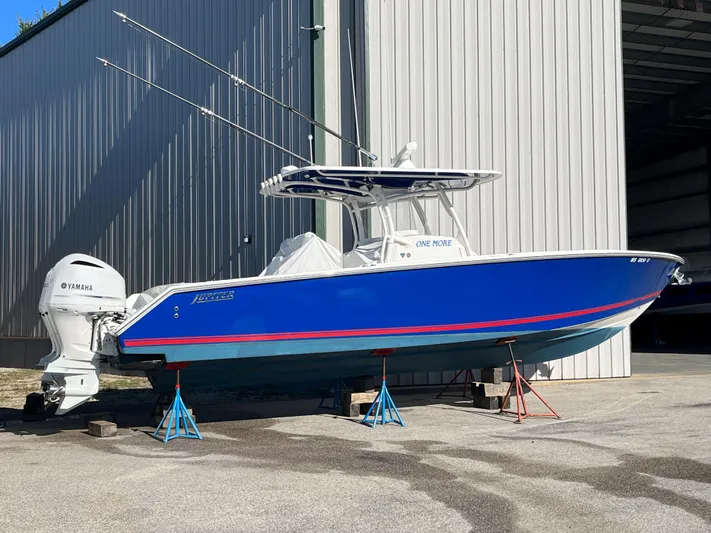  Yacht Photos Pics 2020 Jupiter 34 Center Console boat in blue, docked on stands.