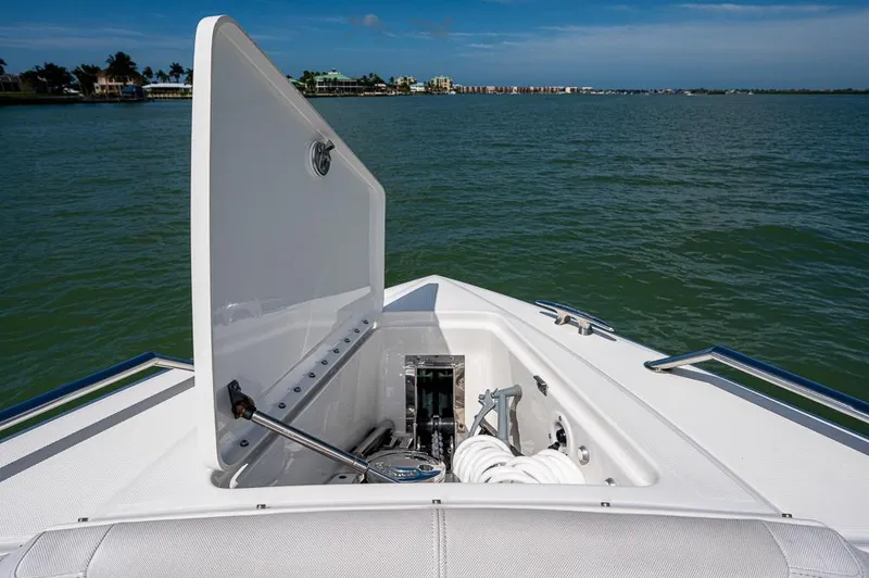  Yacht Photos Pics 2019 Formula 430 Super Sport Crossover boat anchor compartment open on calm water.