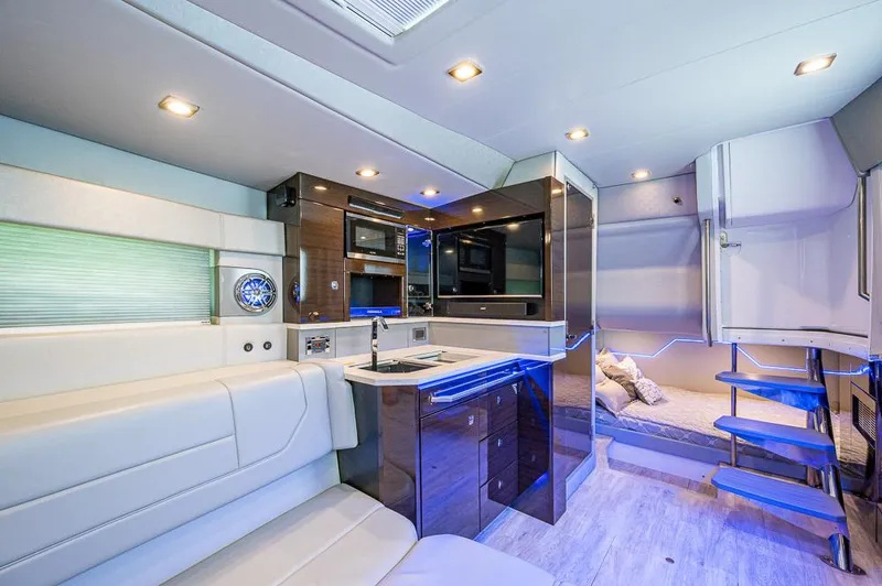  Yacht Photos Pics Luxurious interior of 2019 Formula 430 Super Sport Crossover with modern kitchen and seating area.