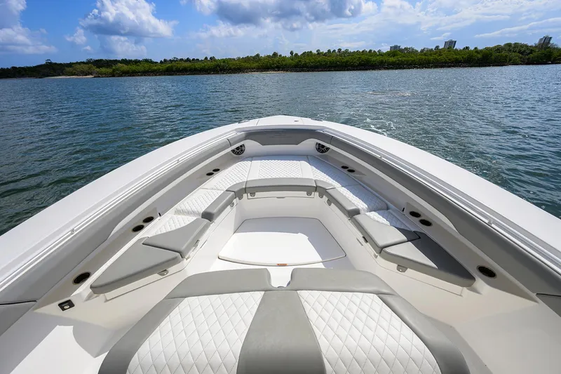  Yacht Photos Pics 2024 Regulator 37 boat interior with luxurious seating on calm water.