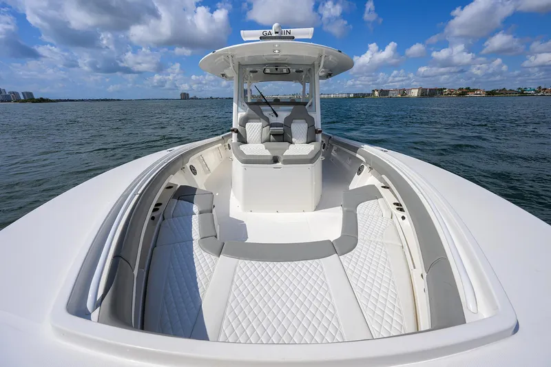  Yacht Photos Pics 2024 Regulator 37 boat on water, featuring spacious deck and modern design.