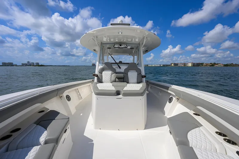  Yacht Photos Pics 2024 Regulator 37 boat on open water under a blue sky.