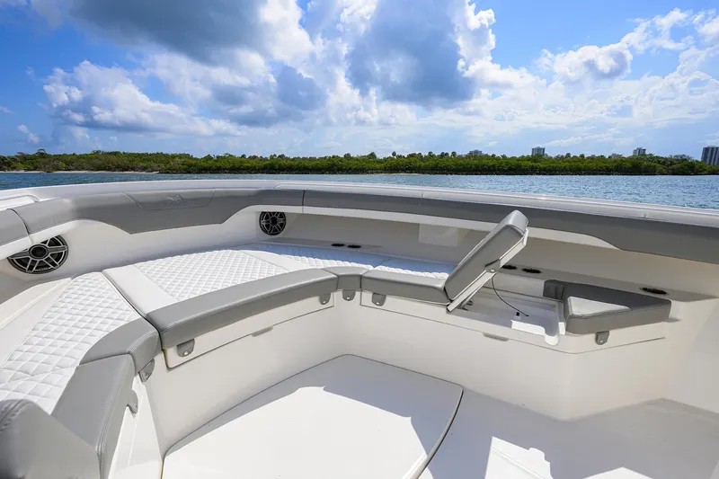  Yacht Photos Pics 2024 Regulator 37 boat interior with luxurious seating and scenic water view.