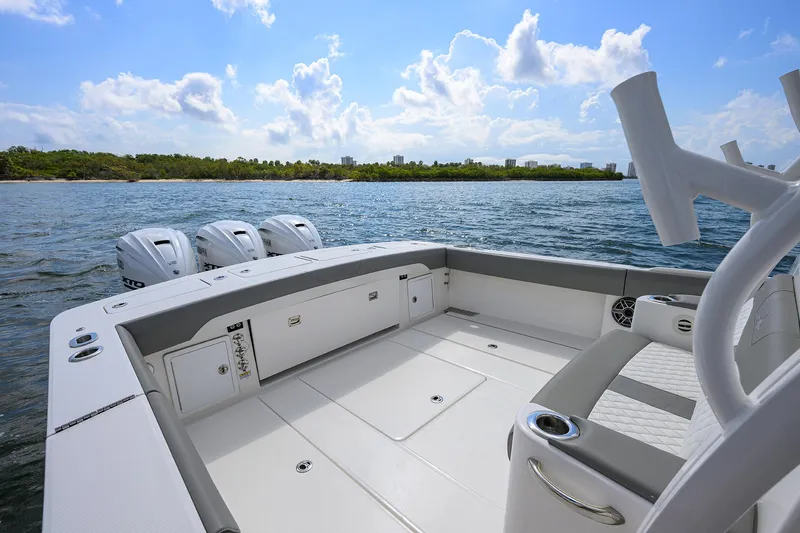  Yacht Photos Pics 2024 Regulator 37 boat deck with quad engines on a sunny day.