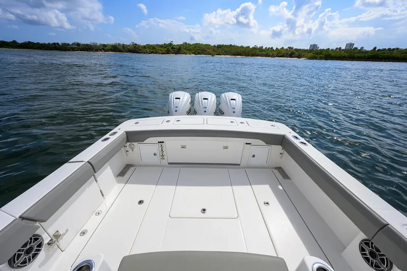  Yacht Photos Pics 2024 Regulator 37 boat deck with triple engines on a sunny day.