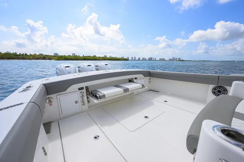  Yacht Photos Pics 2024 Regulator 37 boat deck with scenic ocean view and clear skies.