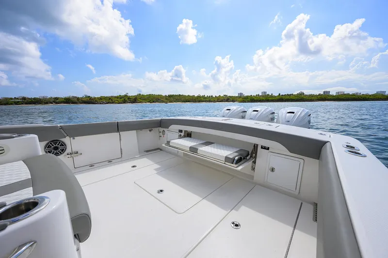  Yacht Photos Pics 2024 Regulator 37 boat deck with scenic water view and clear sky.