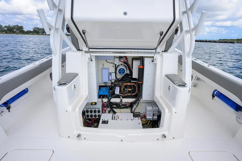  Yacht Photos Pics 2024 Regulator 37 boat interior showing open hatch with electrical components and wiring.